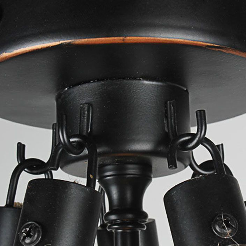Vintage metal pendant light with rope detail. Industrial lighting fixture.