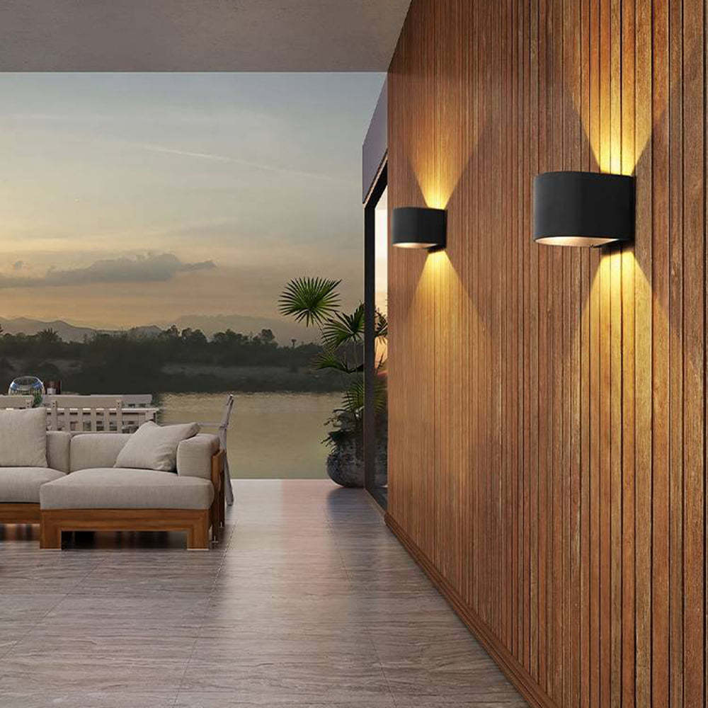Outdoor wall lamp illuminating wooden wall