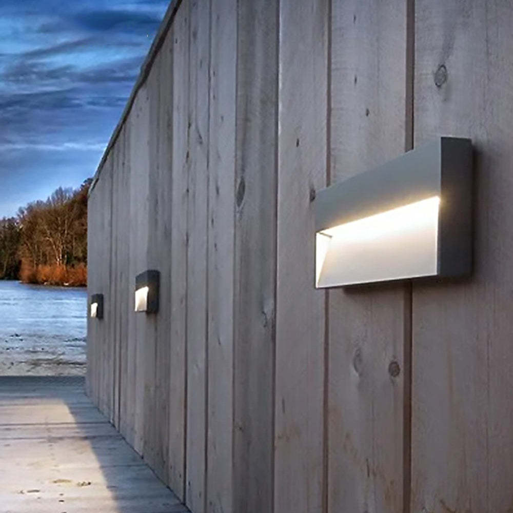 Orr Deck Step Light illuminating wooden wall
