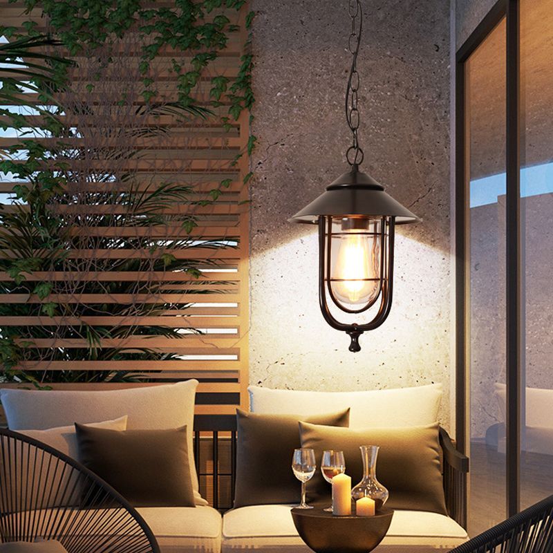 Alessio bronze pendant light over outdoor patio set