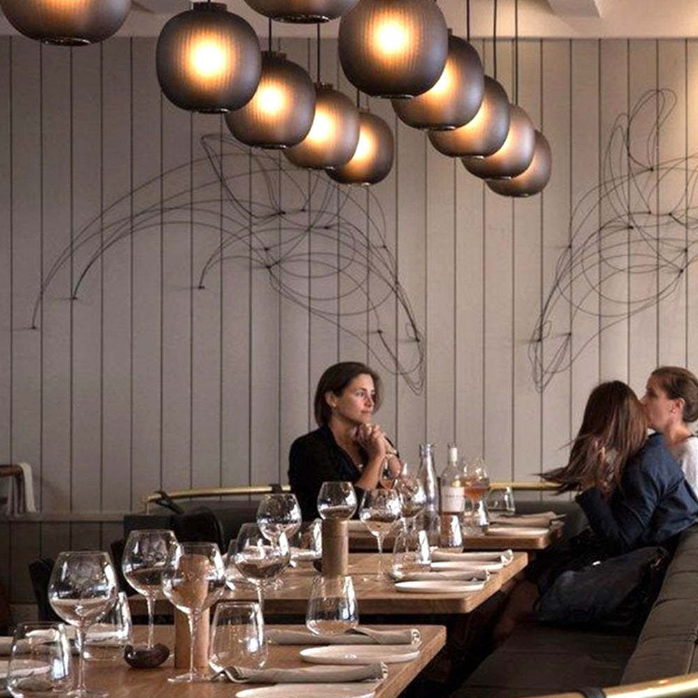 Hailie pendant lights illuminate modern restaurant interior