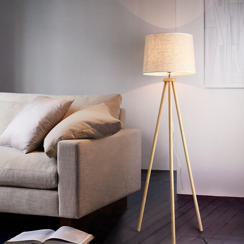 Muto floor lamp with wood tripod base and fabric shade Muto Modern Cylinder Wood Fabric Floor Lamp