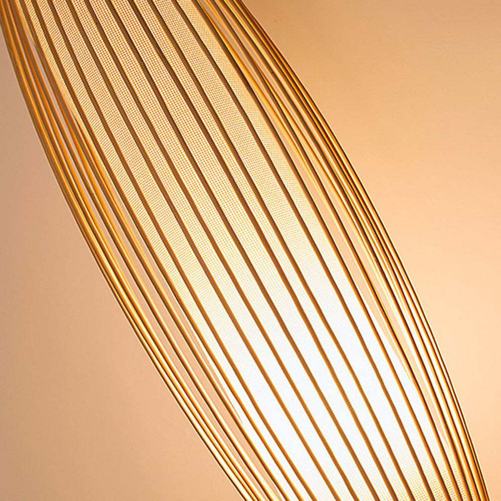 Muto Rattan Wall Lamp close up. Cylindrical Bamboo light detail.