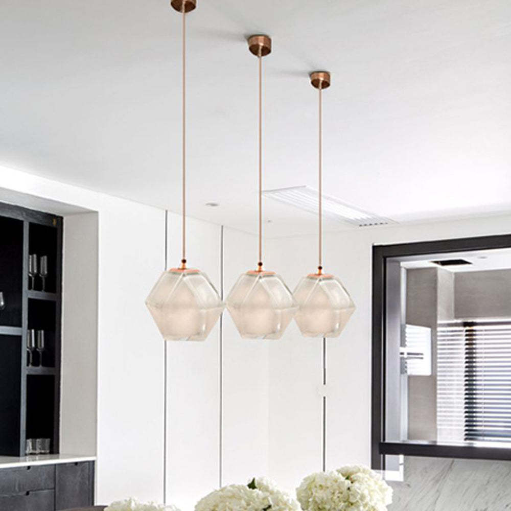 Modern glass pendant lights over dining table