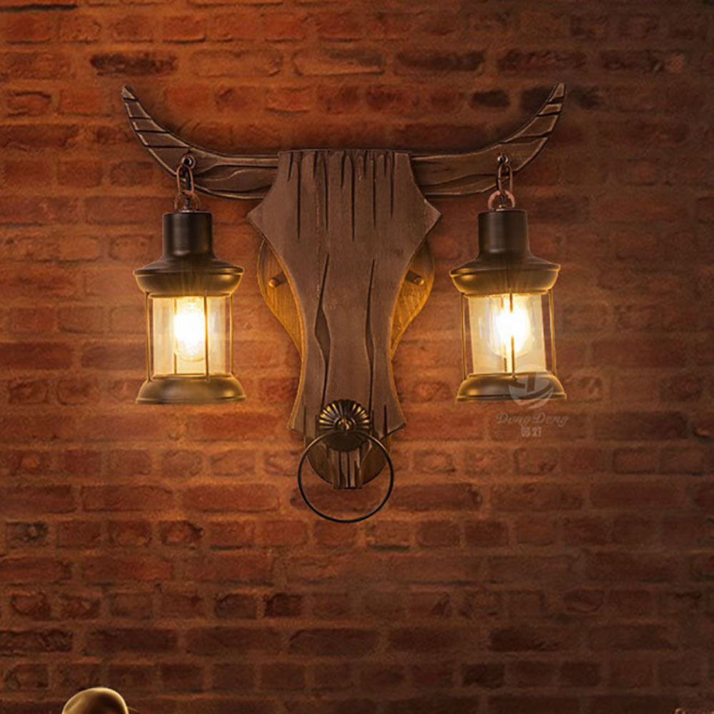 Austin bull head wall lamp with lights on brick wall