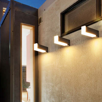 Orr Modern Geometric Outdoor Wall Lamps illuminating a wall
