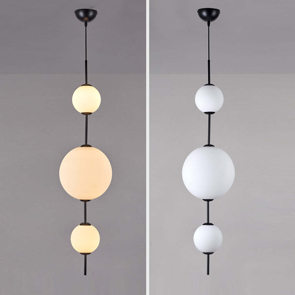 Valentina Ball Pendant Light, black metal fixture with spherical glass shades, warm and cold color