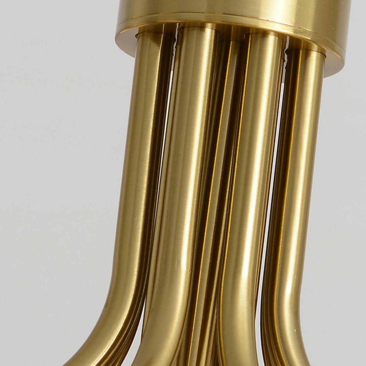 Close-up of gold Valentina chandelier tubes