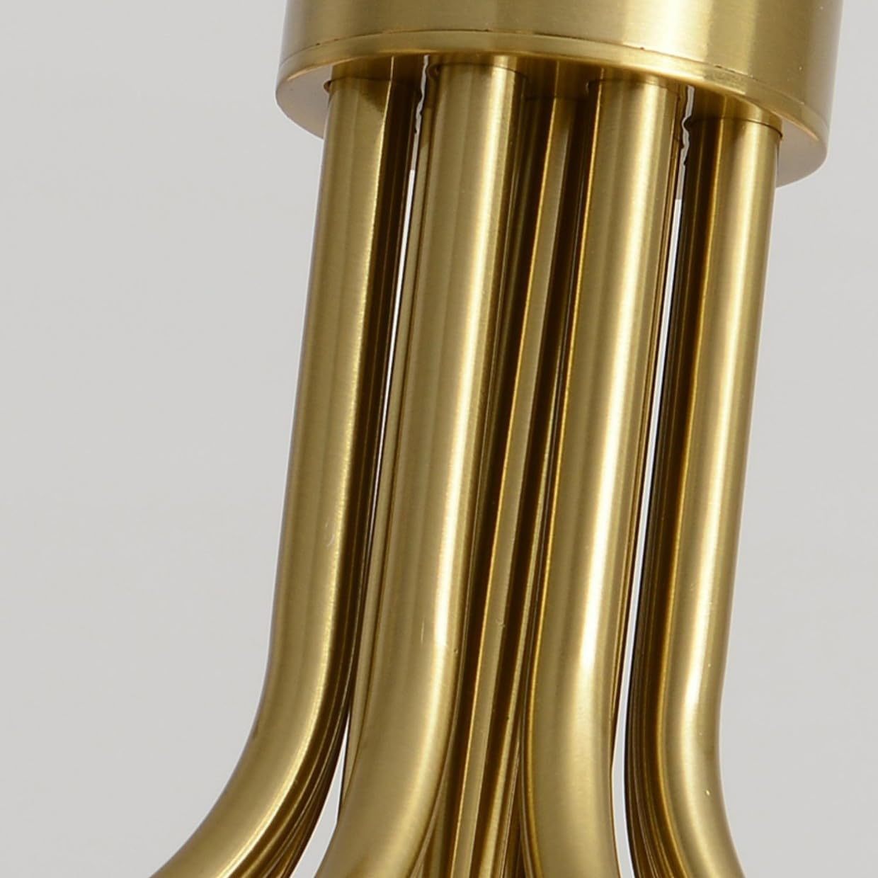Close-up of gold Valentina chandelier tubes