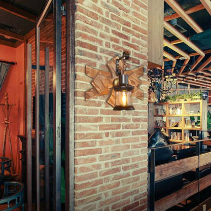 Vintage candle lantern wall lamp on brick wall.