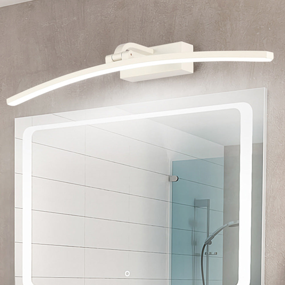 White curved LED wall lamp above a bathroom mirror