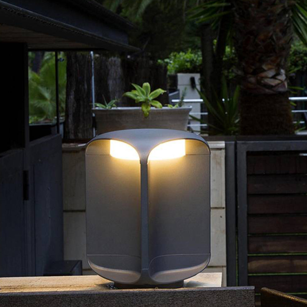 Pena Outdoor Floor Lamp illuminating a garden patio