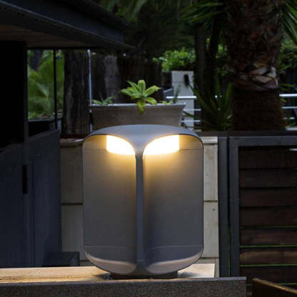 Pena Outdoor Floor Lamp illuminating a garden patio