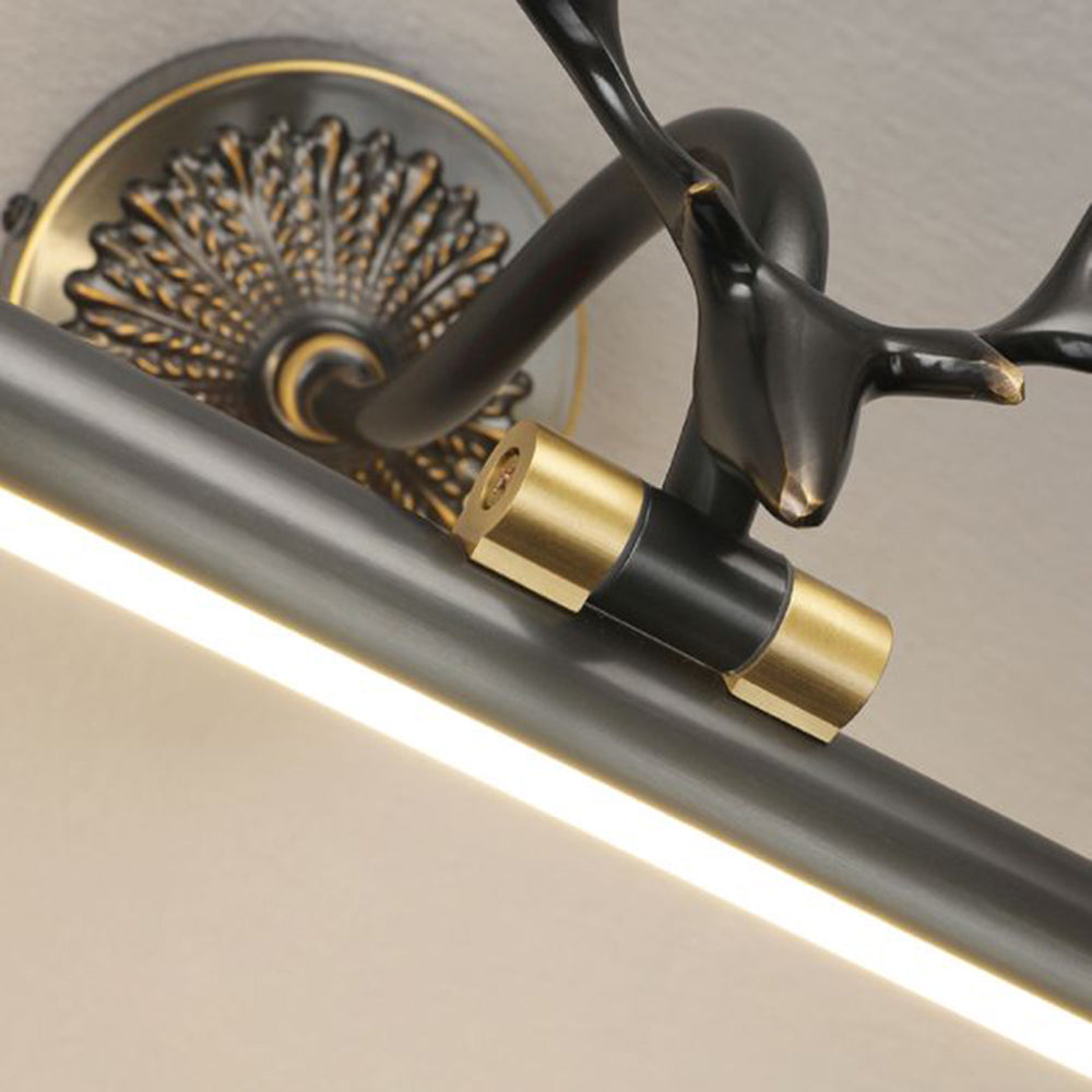 Staghorn vanity light fixture in brass finish.