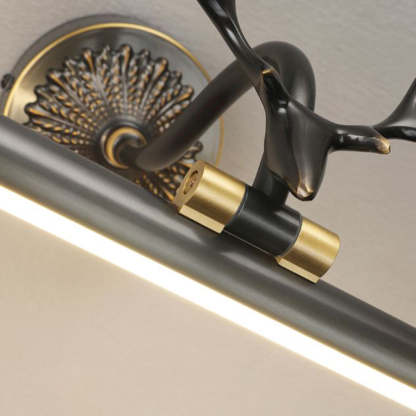 Staghorn vanity light fixture in brass finish.