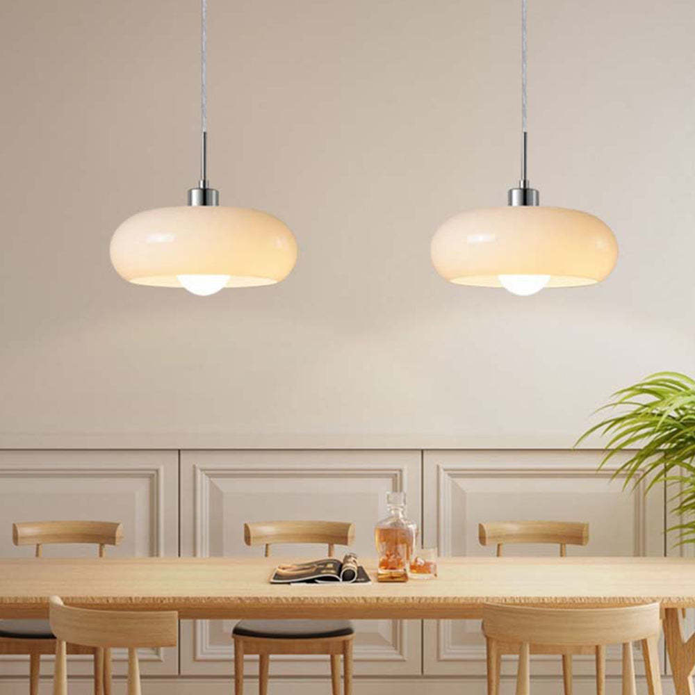 Hailie glass pendant lights over dining table, Las Sola lighting.