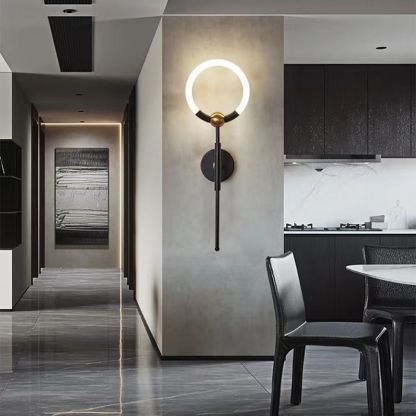 Modern Arisha ring LED wall lamp in black and gold kitchen.