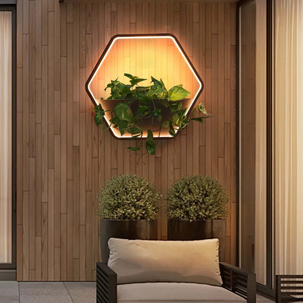 Hexagonal outdoor wall lamp with plants