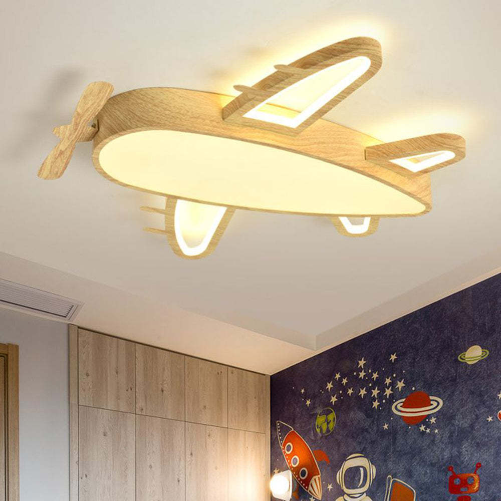 Wood airplane ceiling light in a child's bedroom.