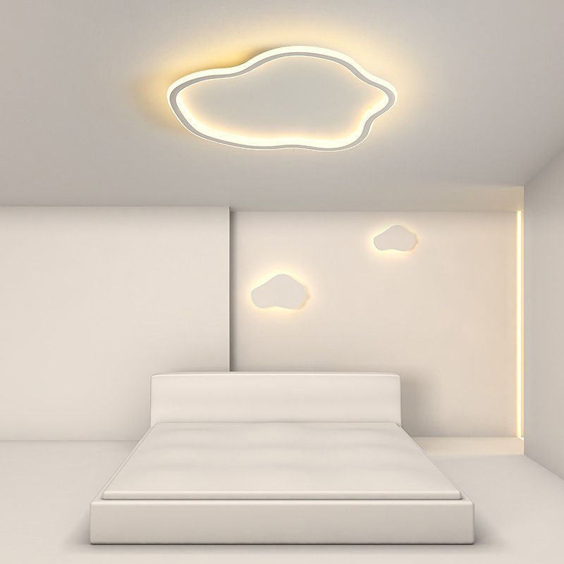 Cloud-shaped ceiling light in a modern bedroom