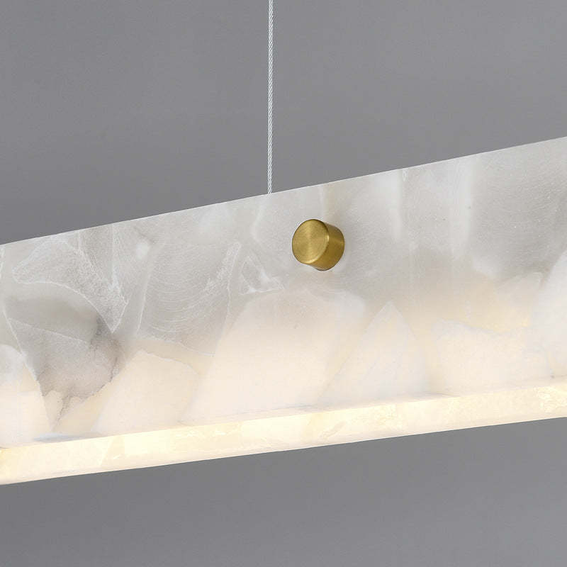 Close-up of marble LED pendant light with a brass accent