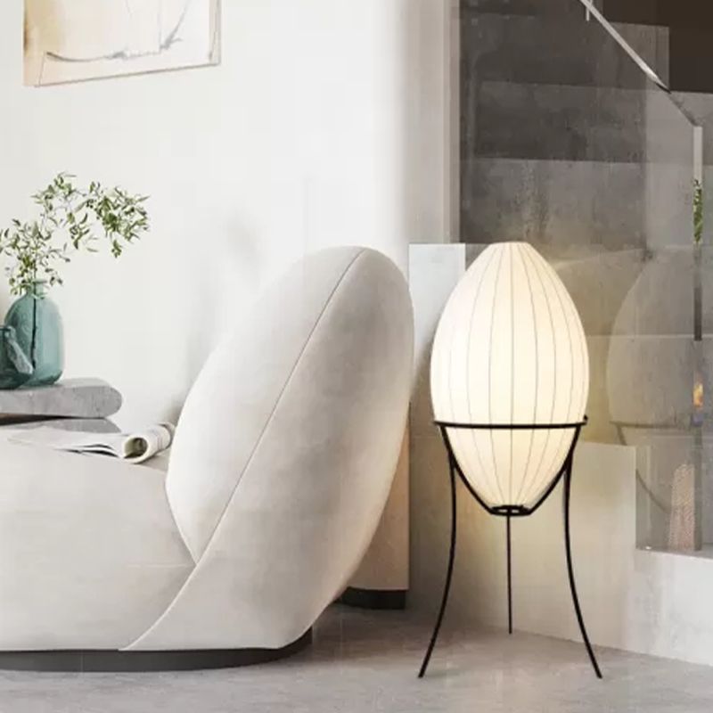 Egg-shaped floor lamp illuminating modern living space