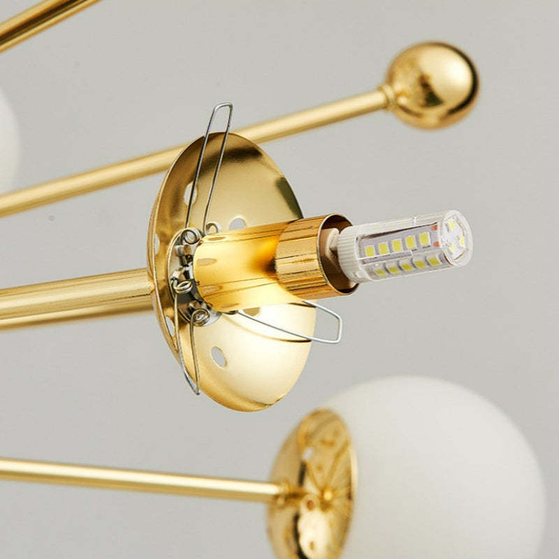 Alessio gold LED chandelier bulb detail. Modern lighting.