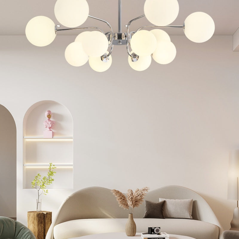 Modern chandelier illuminating a living room interior