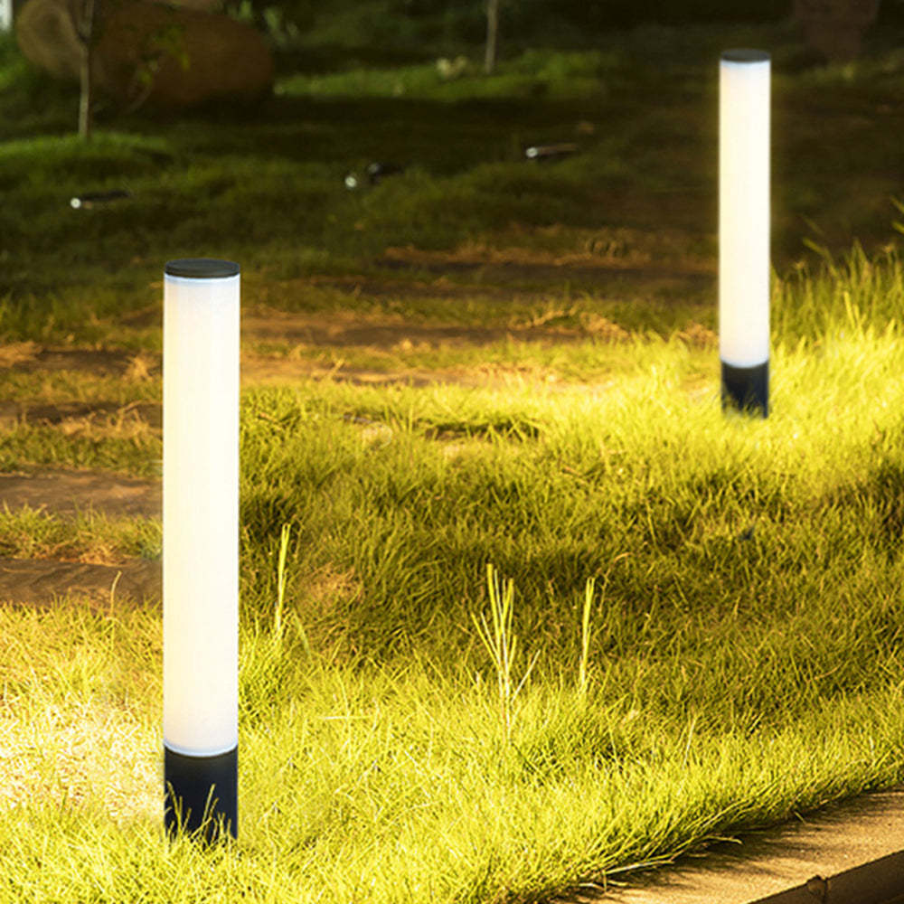 Pena outdoor bollard lights illuminating lawn