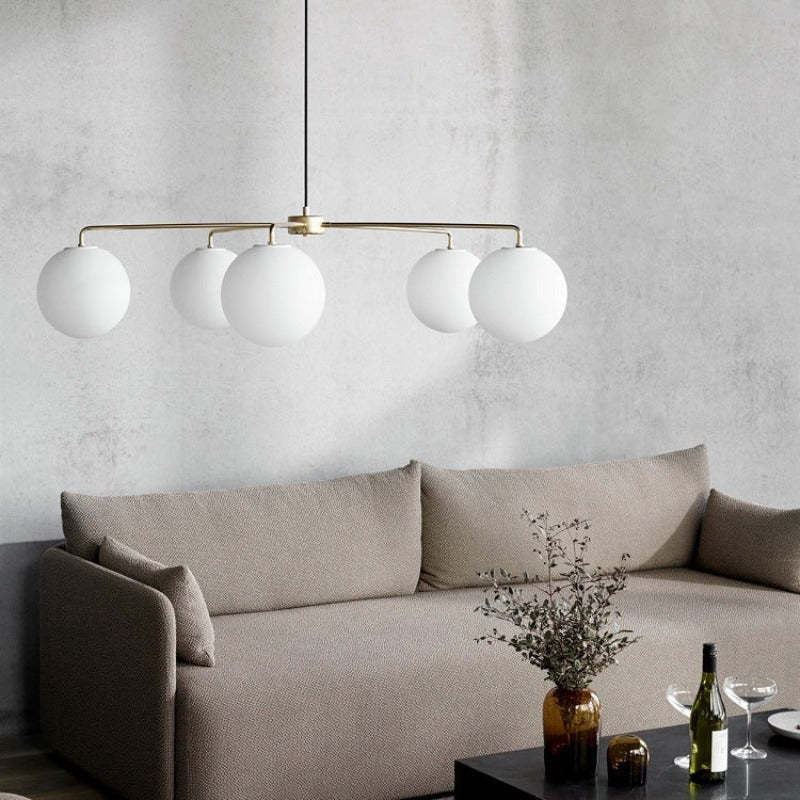 Valentina Chandelier over sofa in bedroom, minimalist interior decor