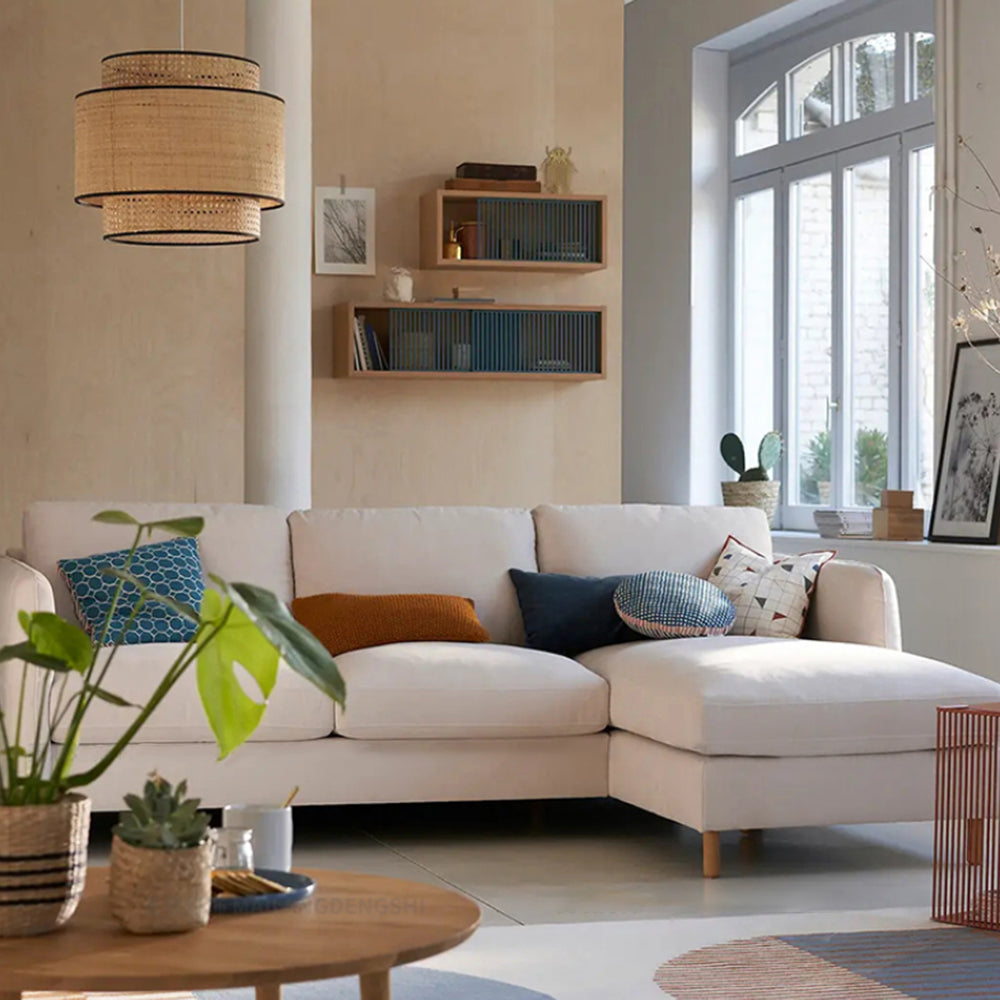 Living room with Ritta Japanese Rattan Pendant Light, sofa and decor