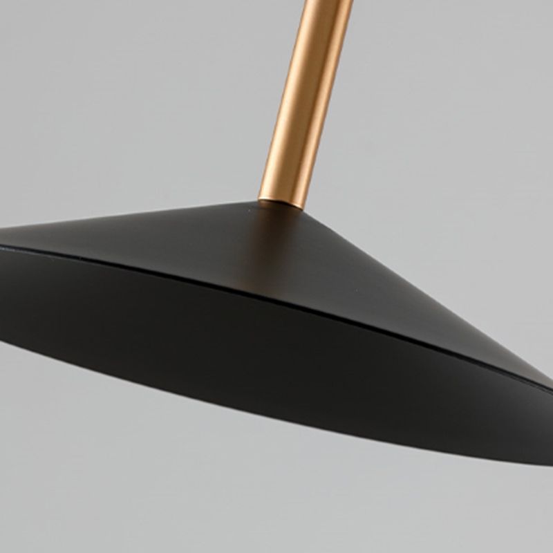Carins Floor Lamp: Black metal shade with gold pole detail.