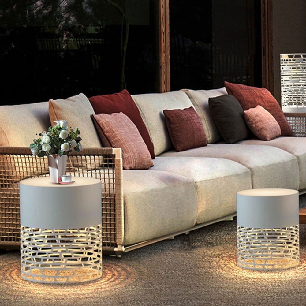 Outdoor patio with Pena path lights illuminating seating area