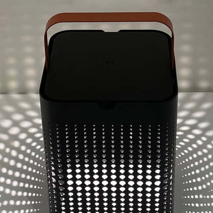 Orr solar floor lamp with lattice shadow pattern.