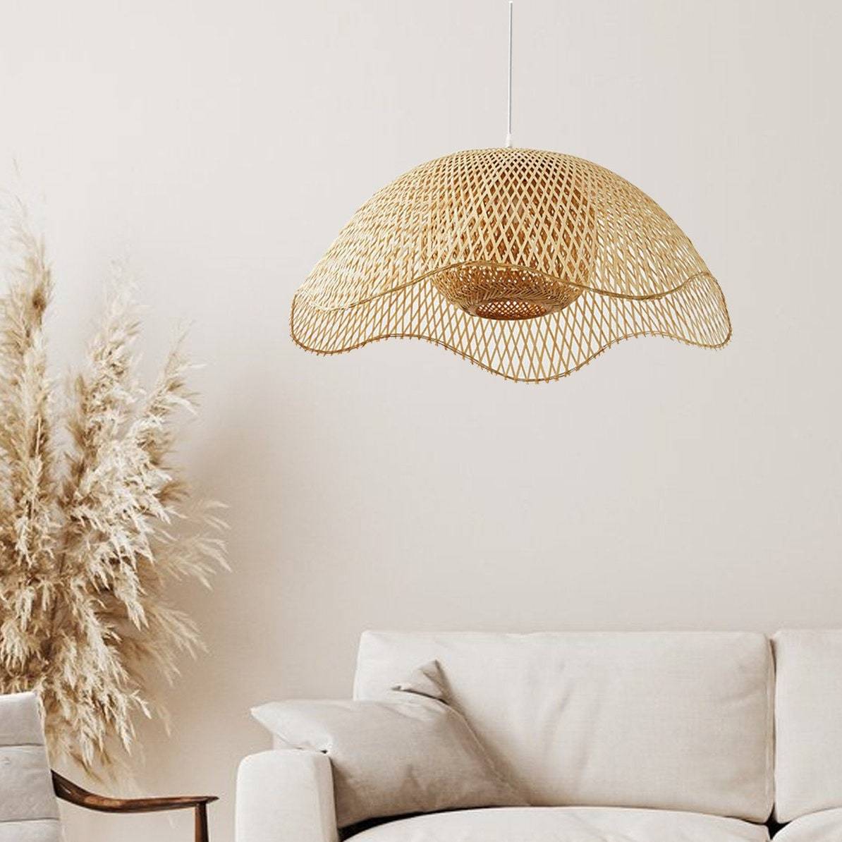 Woven bamboo pendant light above a modern living room sofa