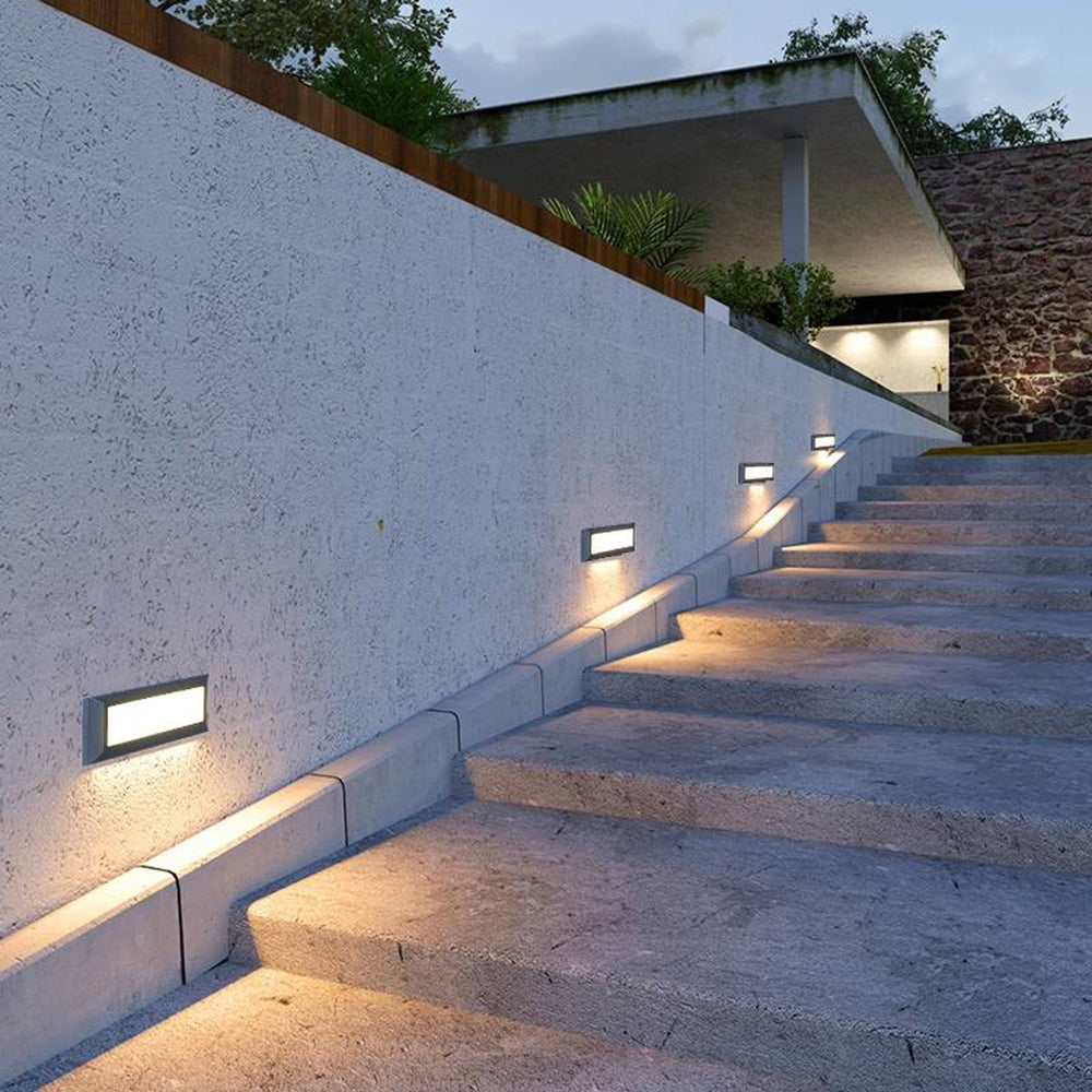 Black metal waterproof step lights on outdoor stairs