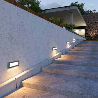 Black metal waterproof step lights on outdoor stairs