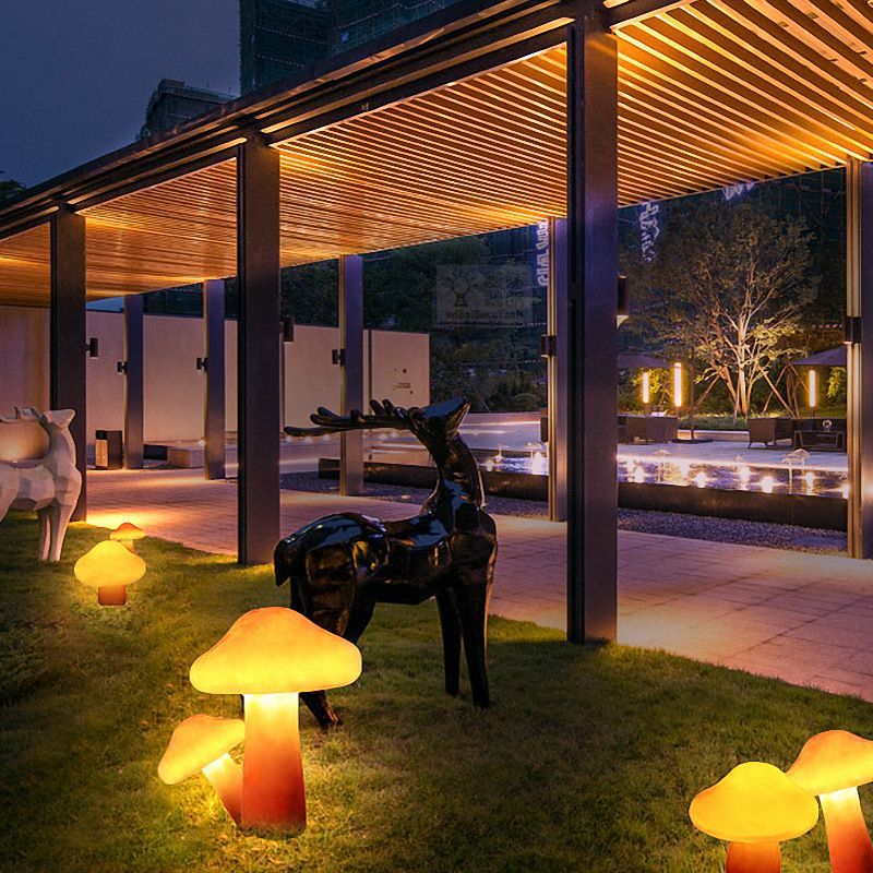 Mushroom Lights & deer statue in garden at night