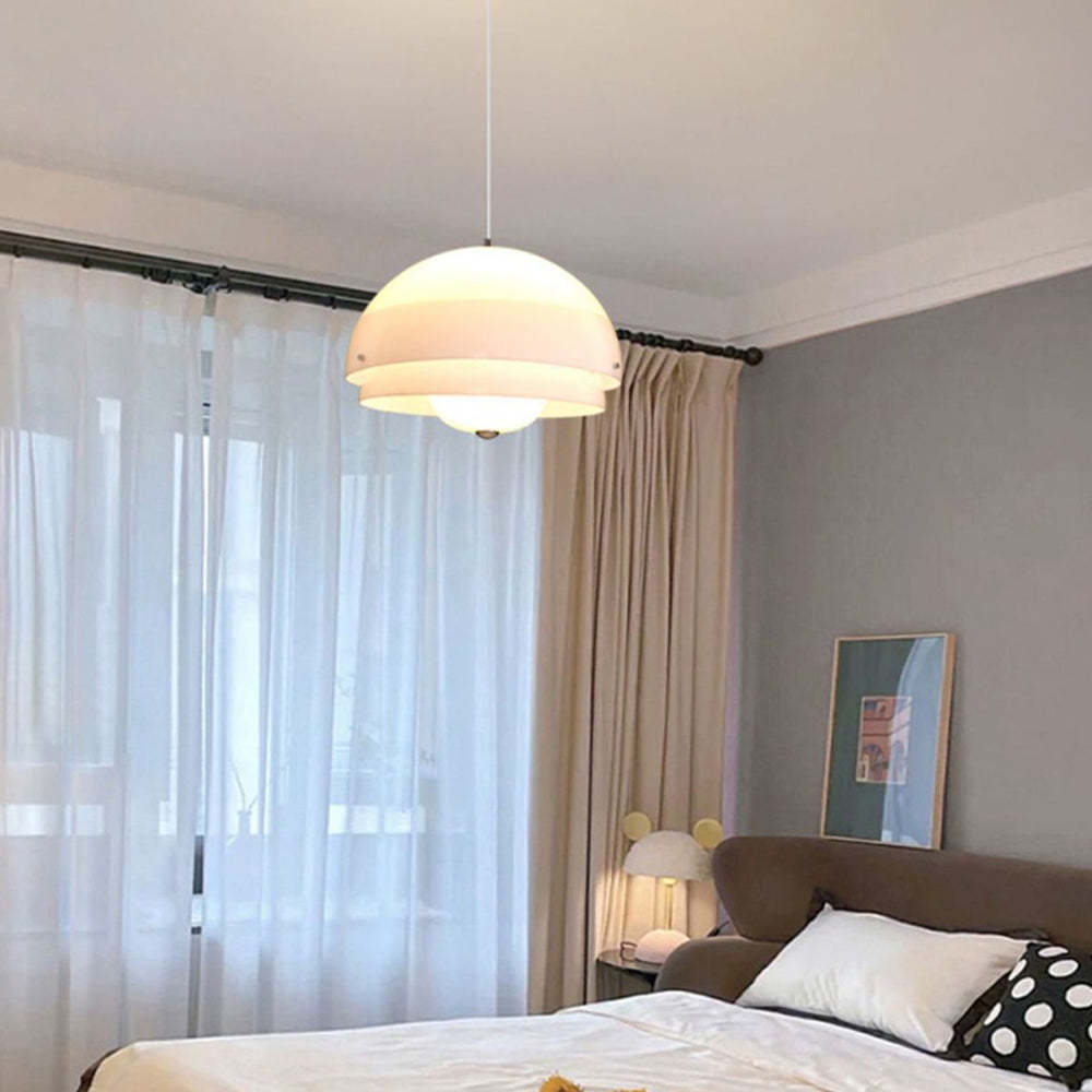 Bauhaus Nordic pendant light illuminating bedroom, modern interior.