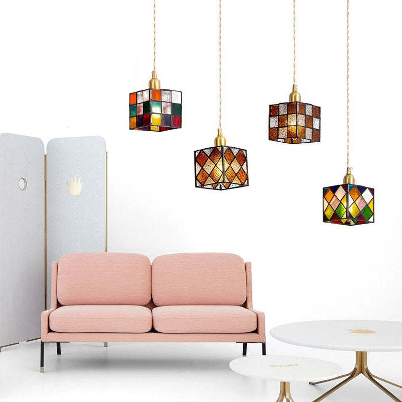 Hailie Retro LED Pendant Lights above a pink sofa and coffee table