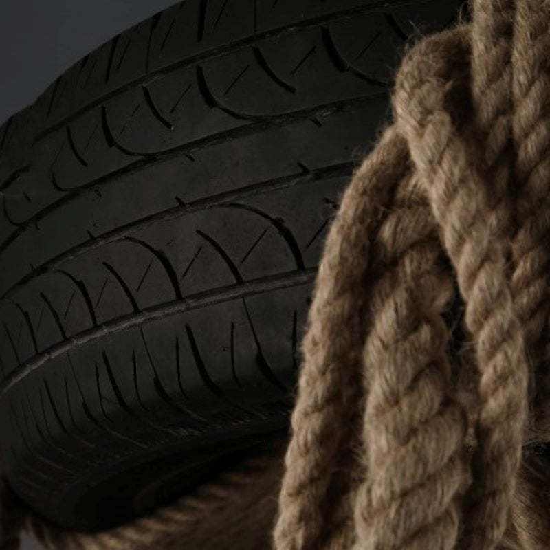Close-up of Epoch Industrial Chandelier materials: hemp rope and tire