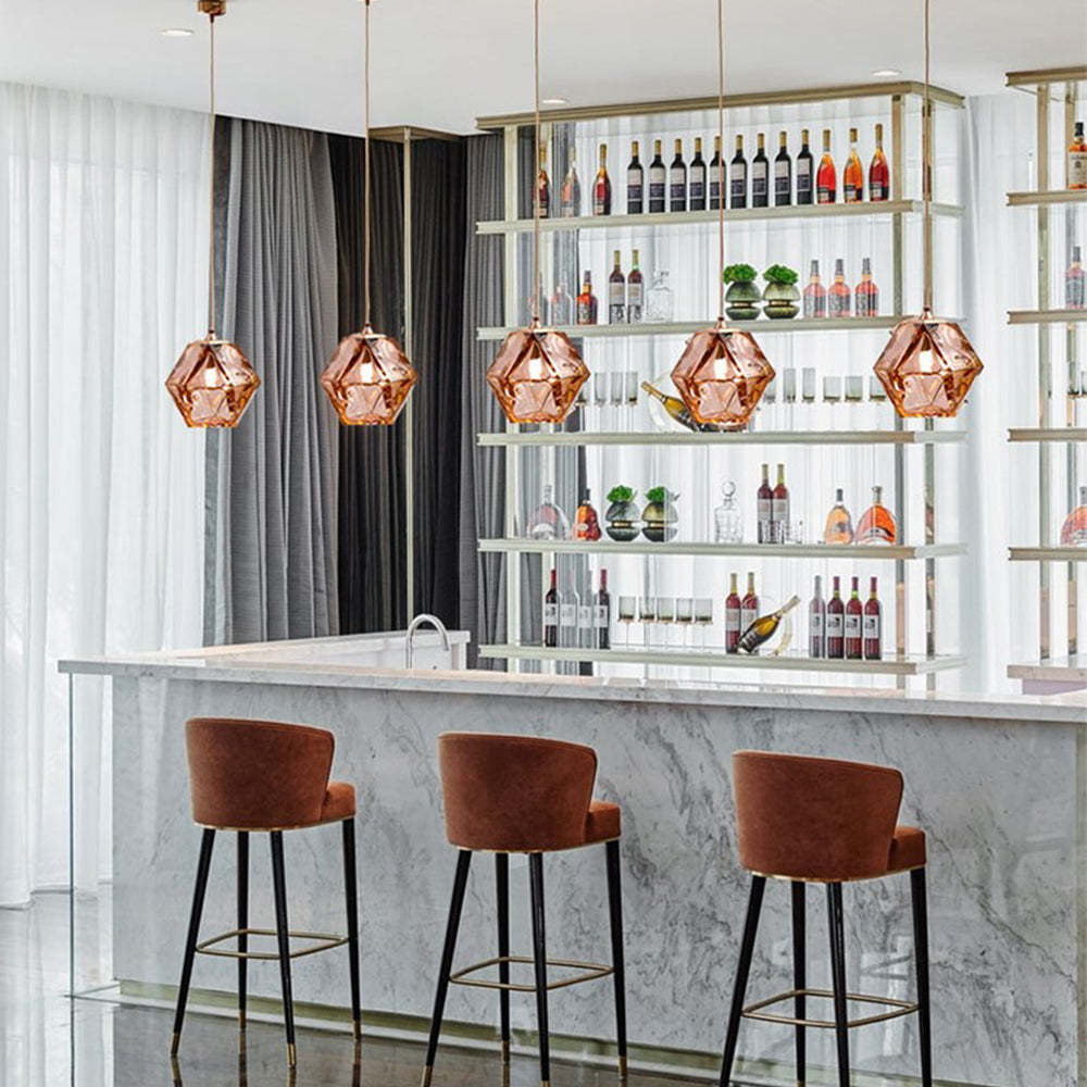 Rose gold Hailie pendant lights over a bar