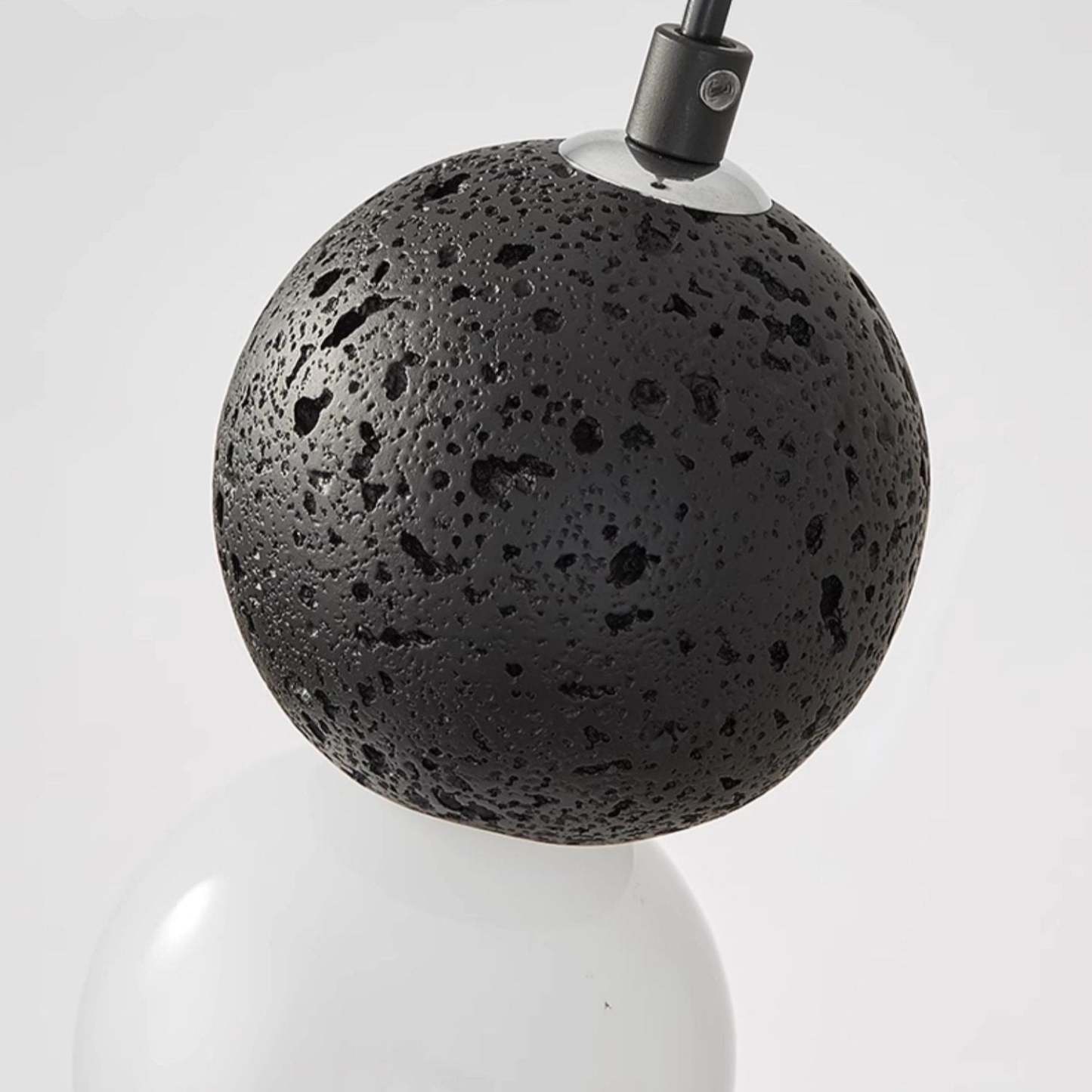 Close-up: Valentina pendant light, black stone globe detail
