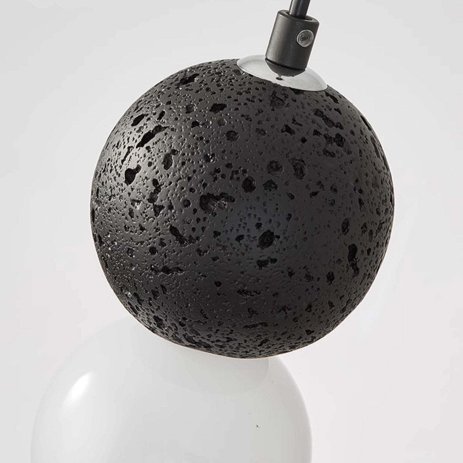 Close-up: Valentina pendant light, black stone globe detail