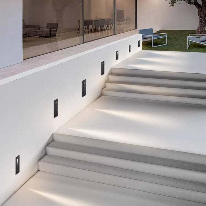 Modern square step lights illuminating outdoor stairs