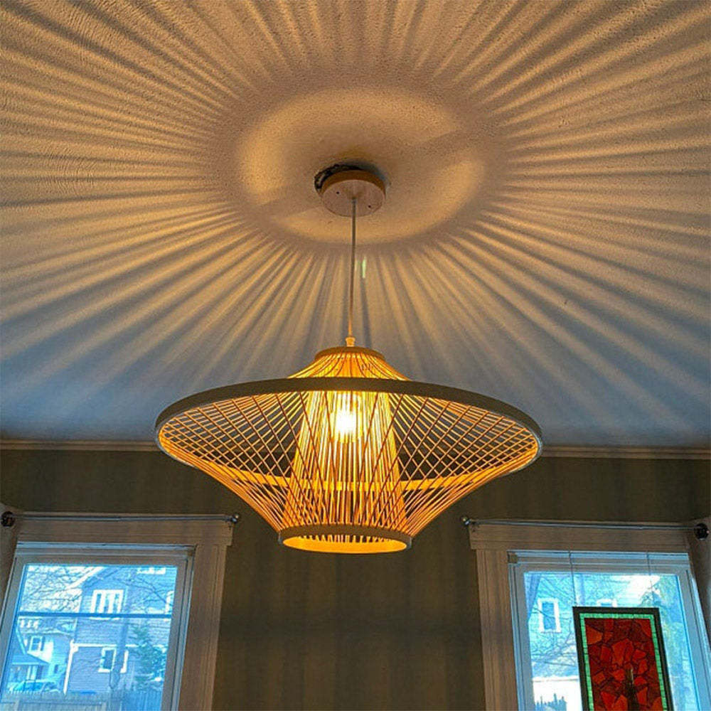 Bamboo pendant light casting patterned shadows, interior decor
