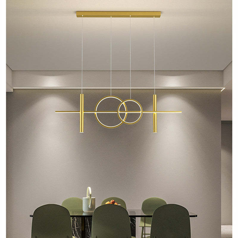 Gold Madina Scandinavian pendant light over dining table
