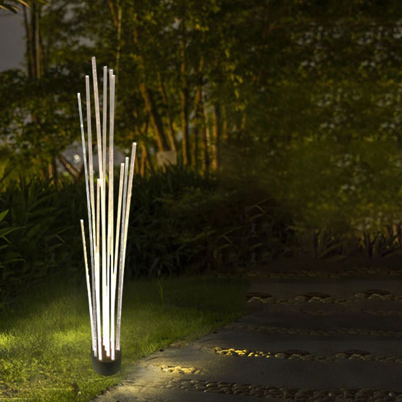 Riley Optical Fiber LED Outdoor Ground Light in a garden setting