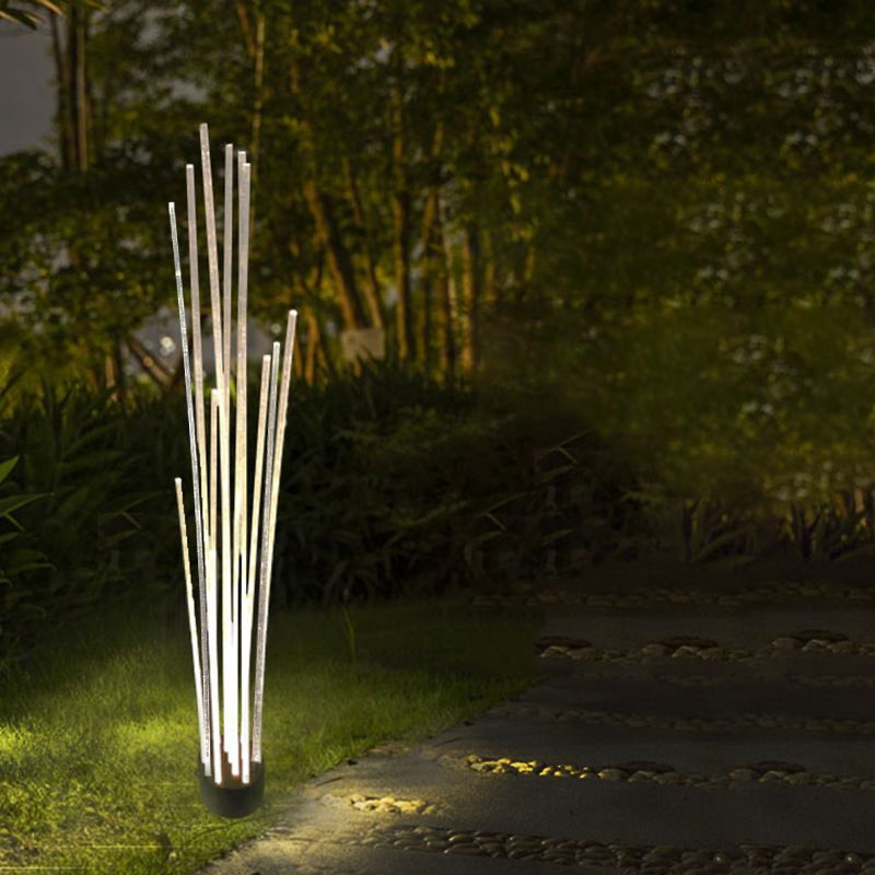 Riley Optical Fiber LED Outdoor Ground Light in a garden setting