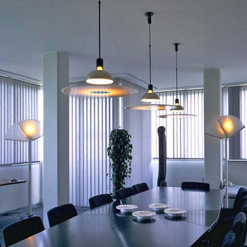 Levi pendant lights illuminating a modern dining room